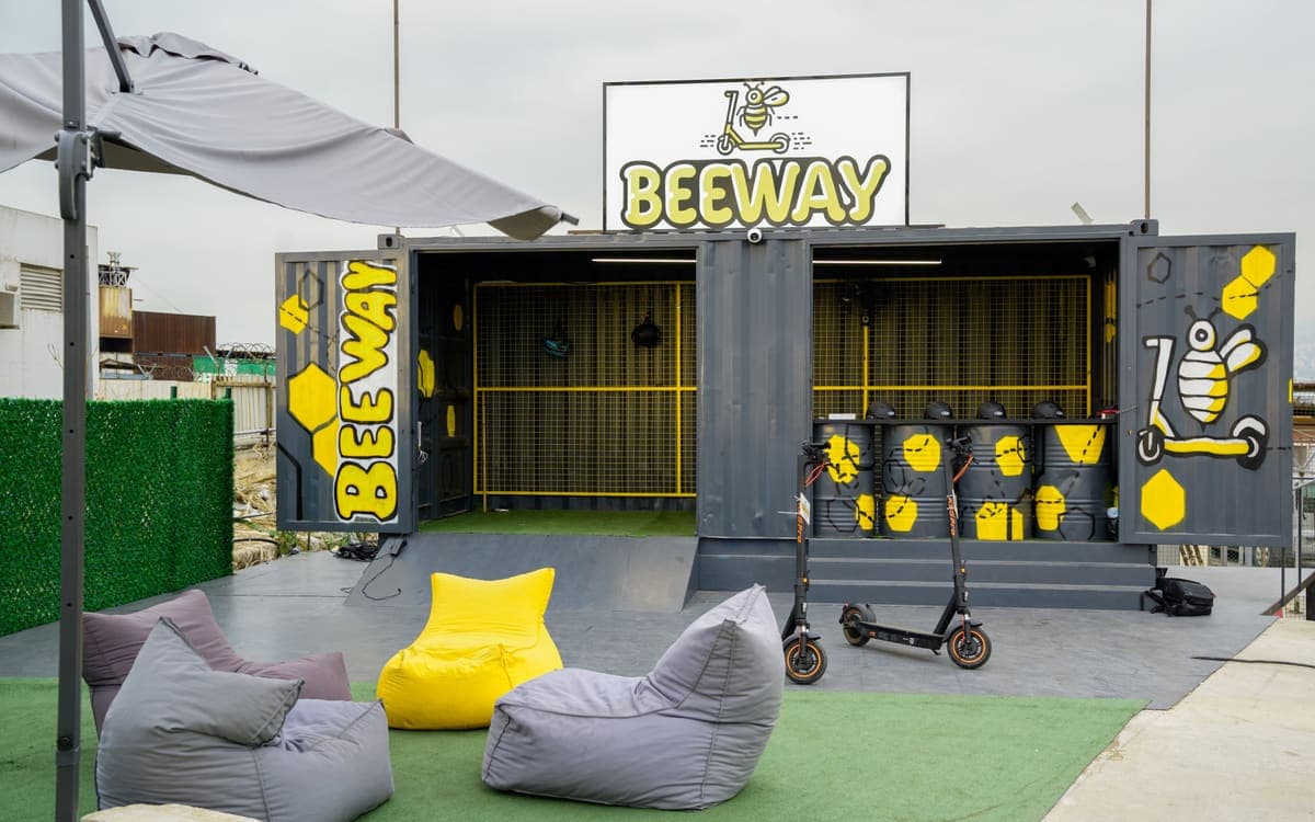 The BeeWay container at Biel Waterfront in Beirut, with scooters and helmets lined up outside